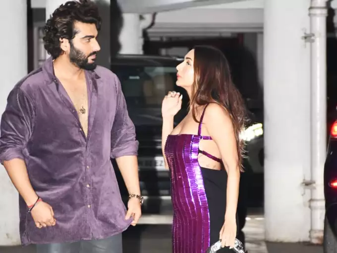 Malaika Arora and Arjun Kapoor's Fashionable Entrance at Party Causes Stir with Backless Dress and Braless Look